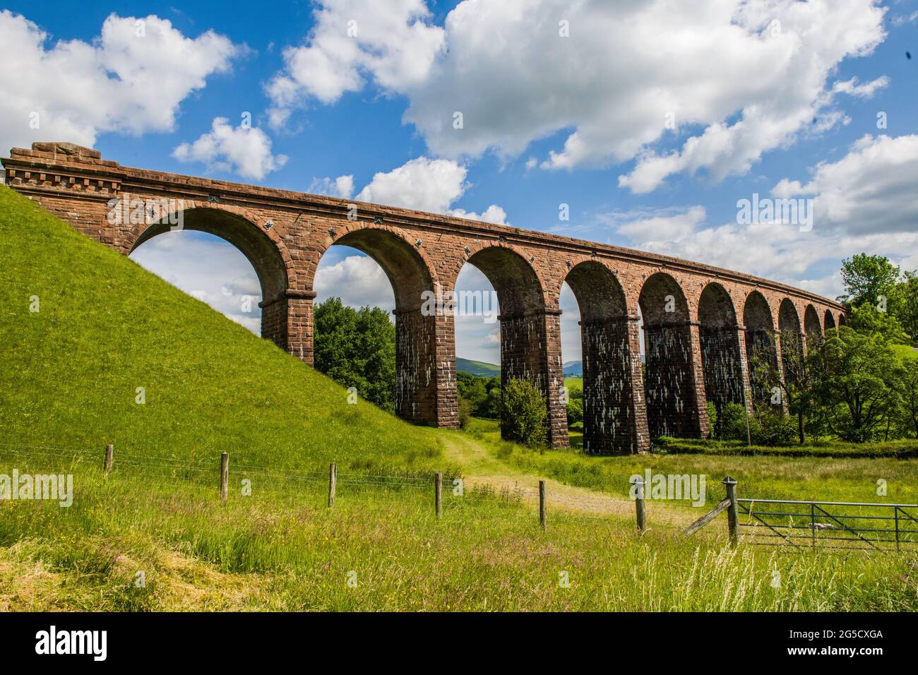 A sadly disused arched railway viaduct (Lowgill Viaduct) at Firbank near Sedbergh in Cumbria North West England Stock Photo