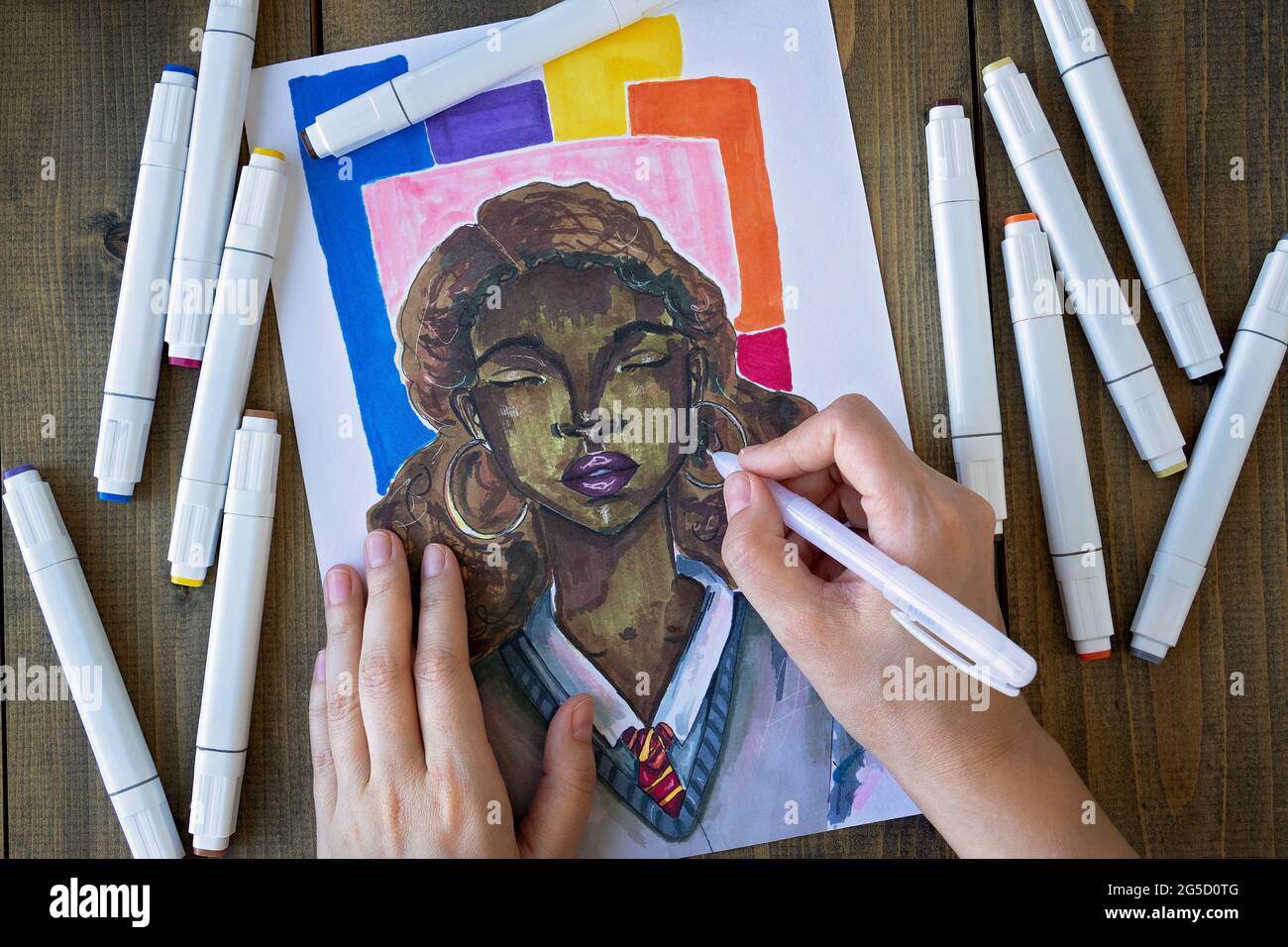 female hands draw with markers a black girl in school uniform. Hobby.  Drawing or sketching with markers. Top view. Flat lay. Soft focus Stock  Photo - Alamy