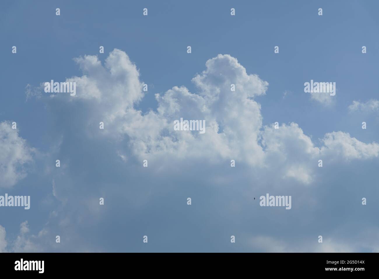 Blue sky with white and grey clouds Stock Photo - Alamy