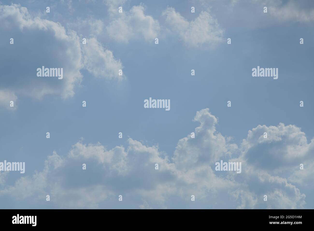 Blue sky with white and grey clouds Stock Photo - Alamy