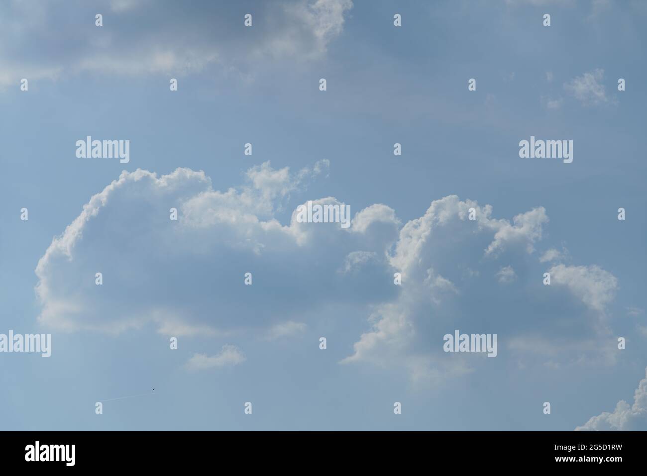 Blue sky with white and grey clouds Stock Photo - Alamy