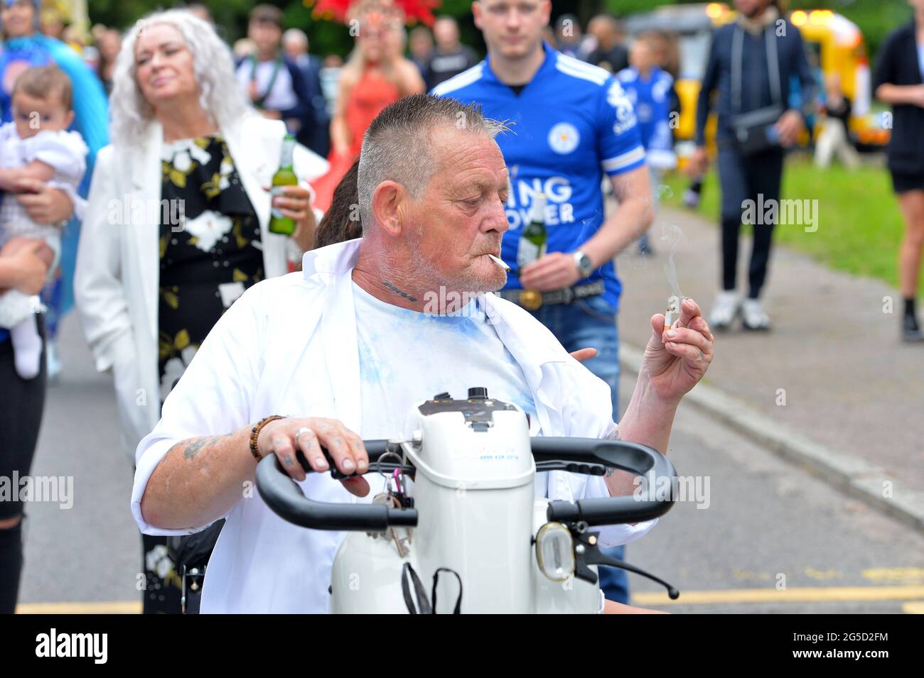Leicester, UK. 26th June 2021. UK News. A funeral carnival parade for Mark Winkless, who turned his back on football hooliganism to persue a career as an actor, takes place around Braunstone Park in Leicester. The parade was attended by former Shameless actor Jody Latham. Alex Hannam/Alamy Live News Stock Photo