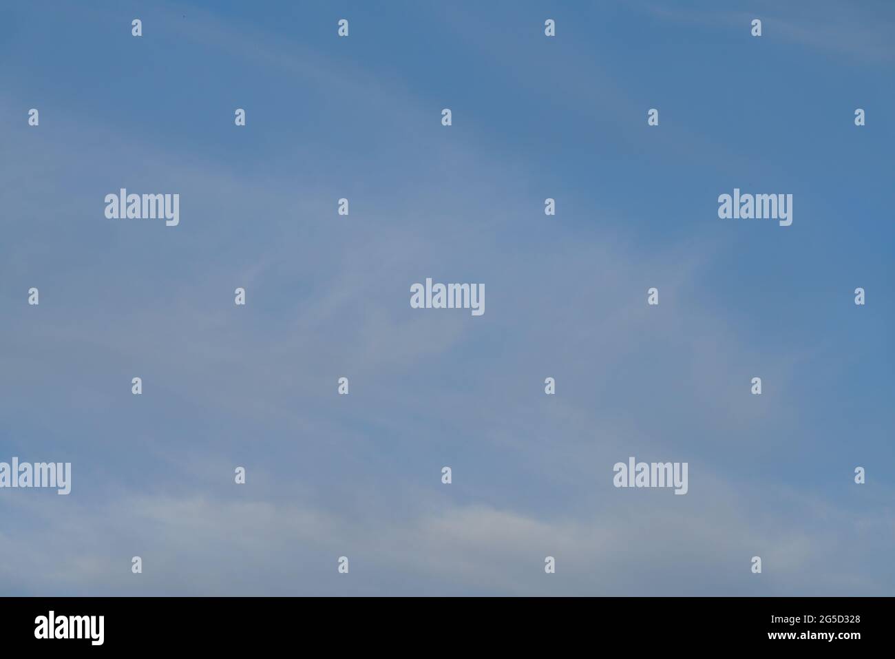Blue sky with white and grey clouds Stock Photo - Alamy