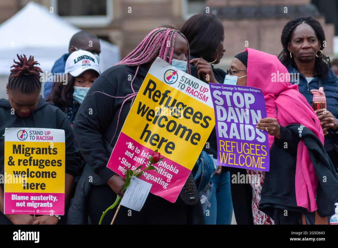 Glasgow, Scotland, UK. 26th June, 2021. On the anniversary of the events at The Park Inn Hotel members of Refugees For Justice gather in George Square to commemorate people seeking asylum who lost their lives during lockdown. Credit: Skully/Alamy Live News Stock Photo