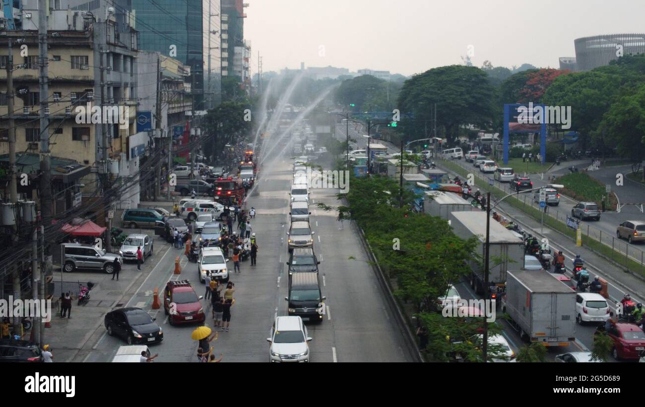 People gather to watch the funeral procession of former President