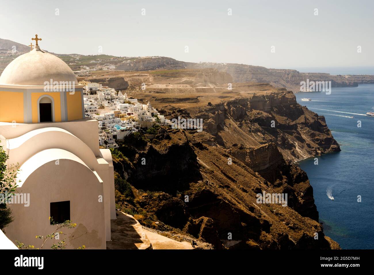 Domed church built on a cliff over the Santorini caldera in the Cycladic vernacular architectural style, Greece. Stock Photo