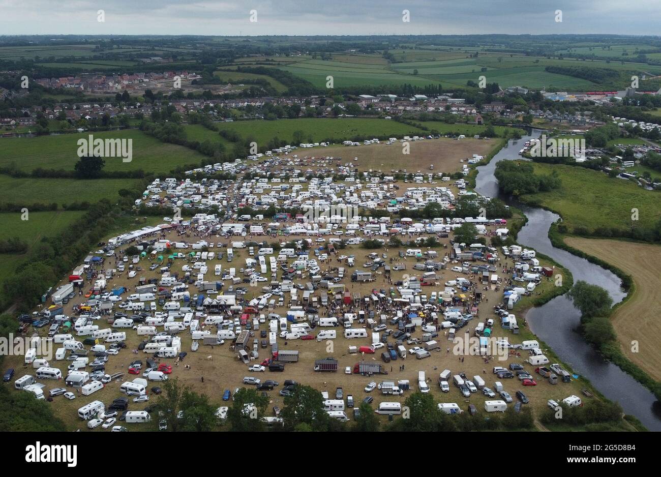 Mountsorrel, Leicestershire, UK. 26th June 2021. An aerial view of the Betty Hensers Horse Fair sited next to the River Soar. Leicestershire Police and Charnwood Borough Council are working together to offer guidance and support to the organisers after concerns about possible breaches in Covid-19 regulations and the impact on local communities. Credit Darren Staples/Alamy Live News. Stock Photo