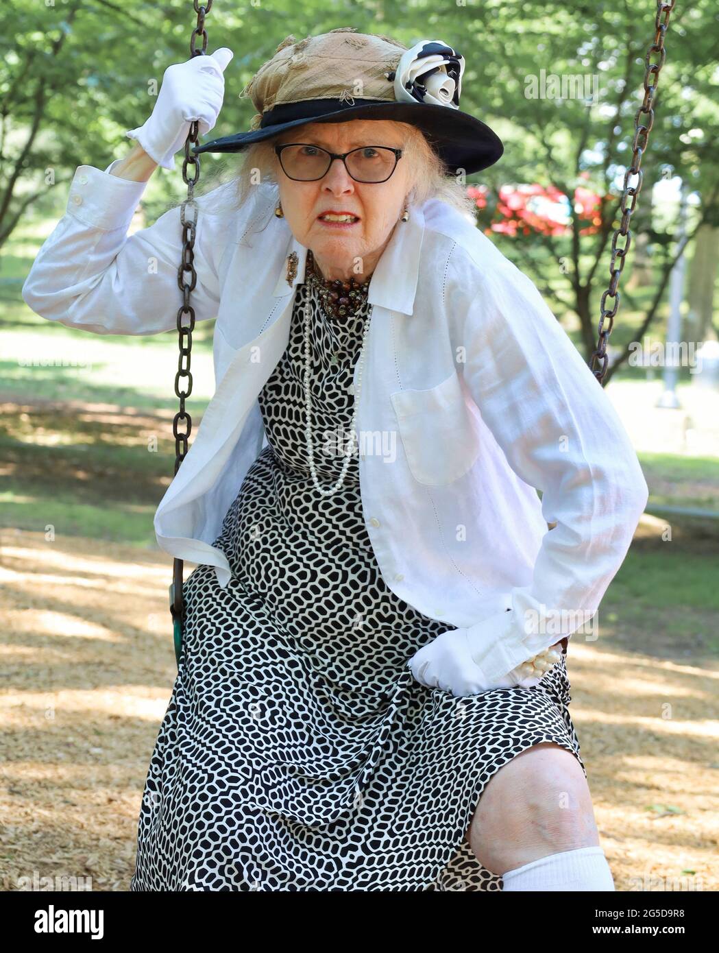 Older woman swinging hi-res stock photography and images - Alamy