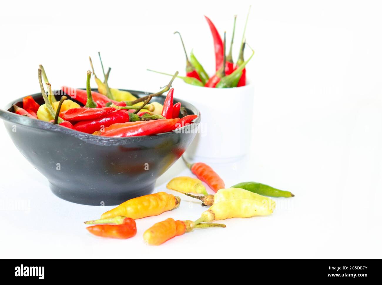 Hot spices, chili pepper aromatic ingredients on a white background