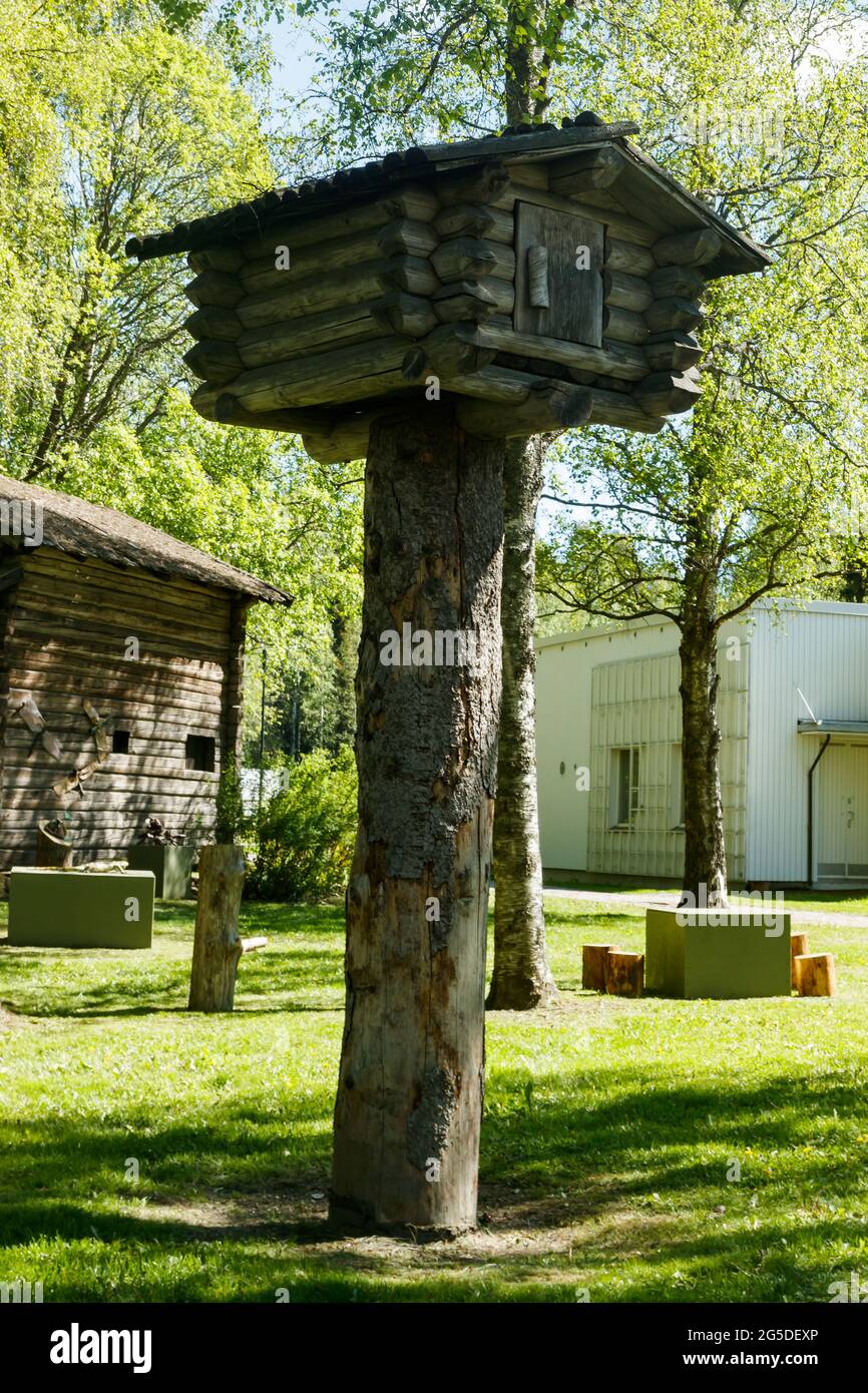 Small tree house made of logs in the forest Stock Photo - Alamy