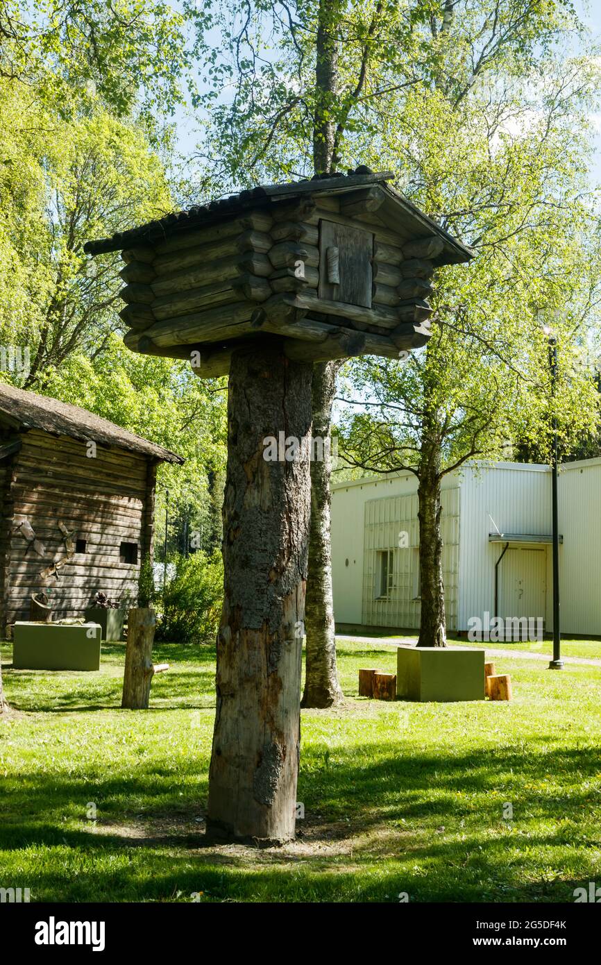 Small tree house made of logs in the forest Stock Photo - Alamy