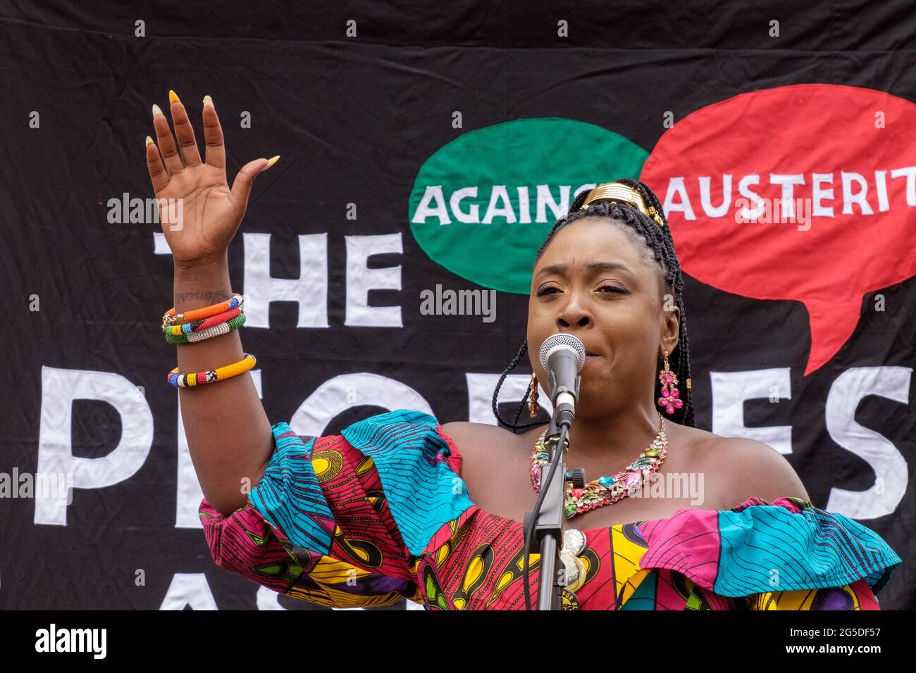 London, UK. 26th June 2021. Black Lives Matter organiser. Over five thousand joined the People's Assembly march through London against the failures of the Tory government during the pandemic, acting too late, handing out contracts to cronies and failing to reward key workers for their sacrifices. They demanded a 'new normal' with an end to NHS privatisation, decent housing, real action over climate change, decent housing, an end to unfair employment practices and the sacking of corrupt politicians. Peter Marshall/Alamy Live News Stock Photo