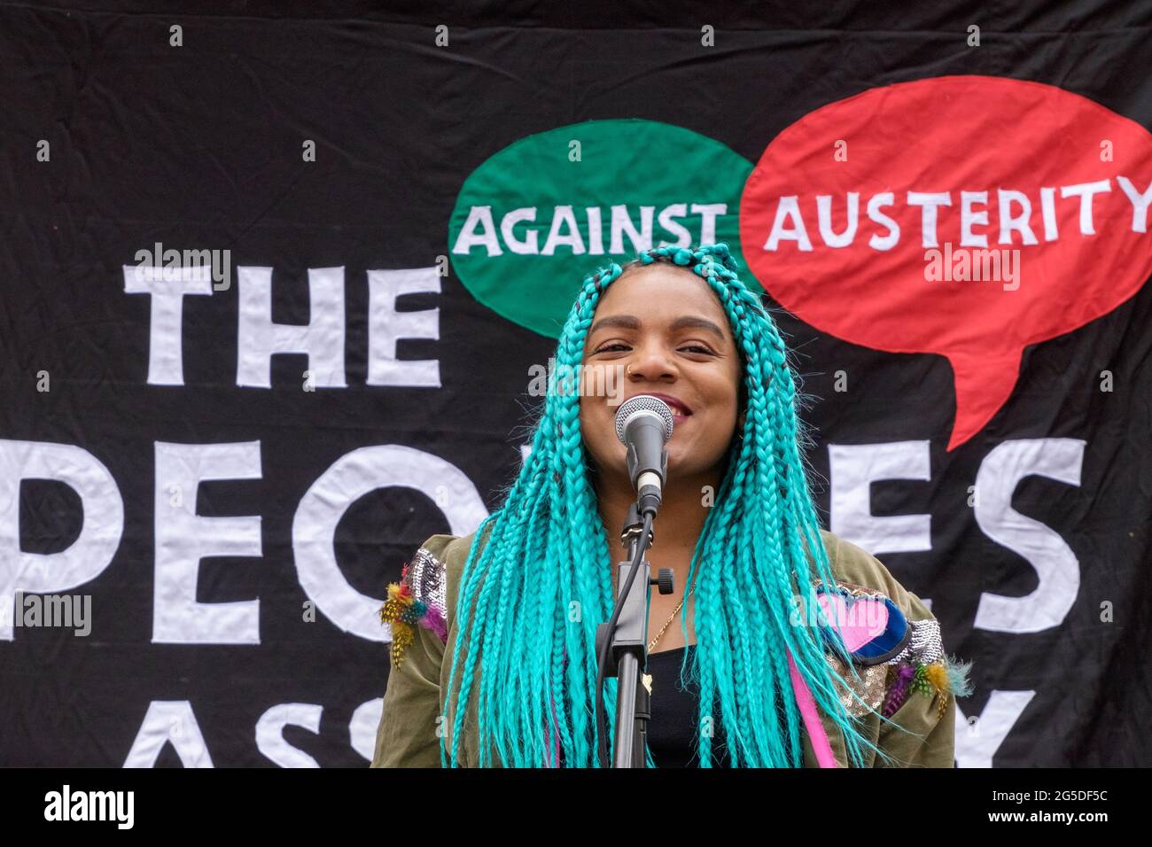 London, UK. 26th June 2021. Liverpool Black Lives Matter speaker. Over five thousand joined the People's Assembly march through London against the failures of the Tory government during the pandemic, acting too late, handing out contracts to cronies and failing to reward key workers for their sacrifices. They demanded a 'new normal' with an end to NHS privatisation, decent housing, real action over climate change, decent housing, an end to unfair employment practices and the sacking of corrupt politicians. Peter Marshall/Alamy Live News Stock Photo