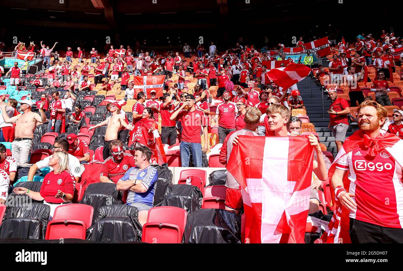 Denmark fans cheer their team during the UEFA Euro 2020 round of 16 match held at the Johan Cruijff ArenA in Amsterdam, Netherlands. Picture date: Saturday June 26, 2021. Stock Photo