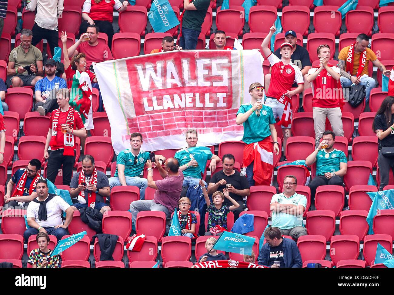 Denmark fans cheer their team during the UEFA Euro 2020 round of 16 match held at the Johan Cruijff ArenA in Amsterdam, Netherlands. Picture date: Saturday June 26, 2021. Stock Photo