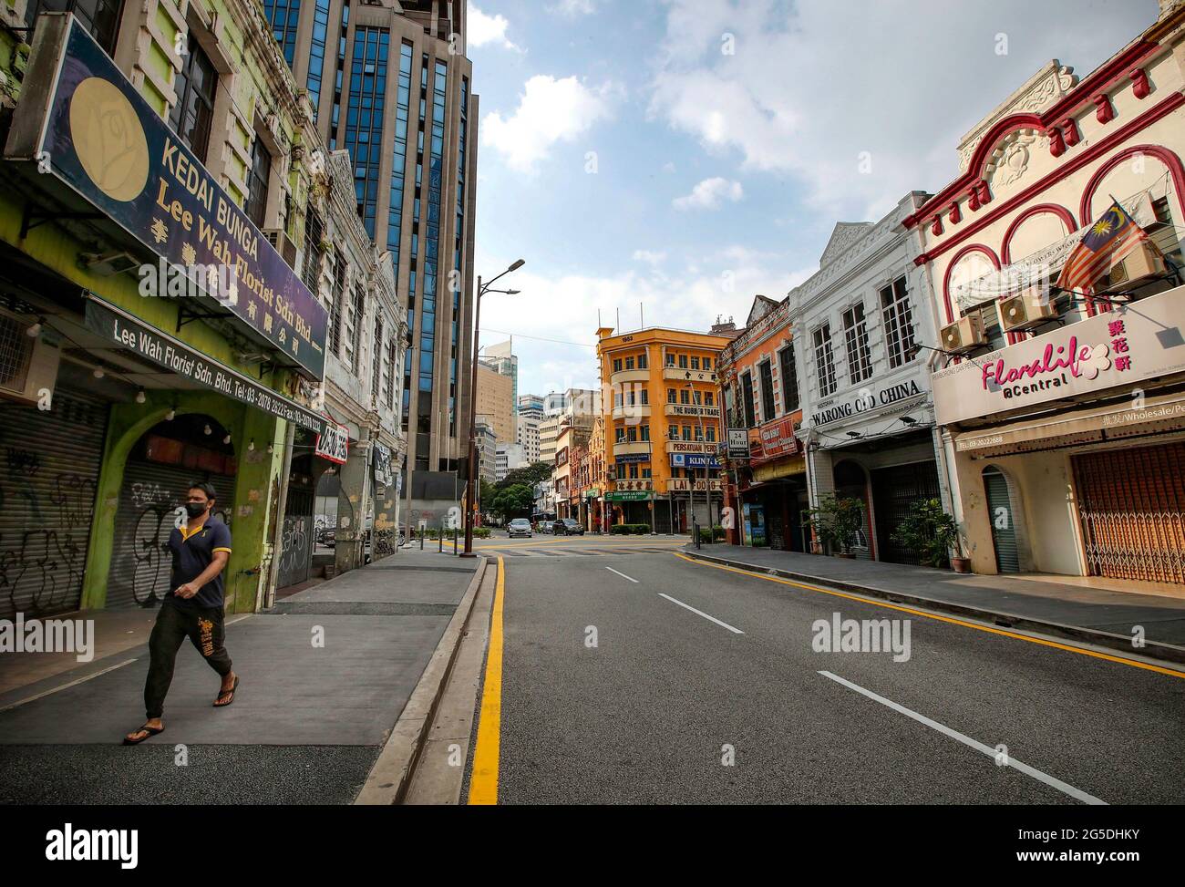 Kuala Lumpur Malaysia 26th June 2021 A Man Wearing A Face Mask As Precaution Measures Against The Spread Of Coronavirus Walks Along The Deserted China Town Street Malaysia Has Recorded 5 803 New Covid 19