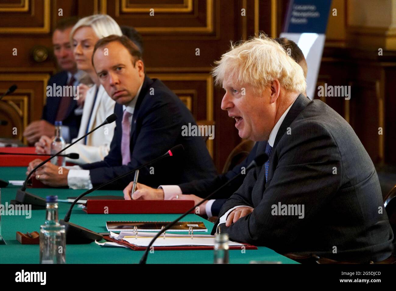 File photo dated 15/9/2020 of Matt Hancock as he listens to Prime Minister Boris Johnson (right) during a Cabinet meeting at the Foreign and Commonwealth Office (FCO) in London. Hancock has resigned as Health Secretary in a letter to Boris Johnson where he says the Government 'owe it to people who have sacrificed so much in this pandemic to be honest when we have let them down'. Issue date: Saturday June 26, 2021. Stock Photo