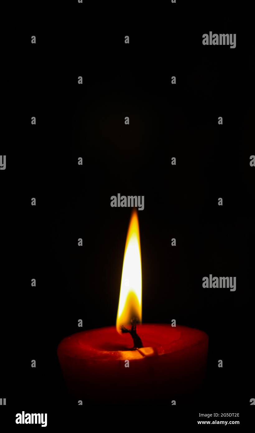 lighting candles, Burning candle on black background, Candle in the