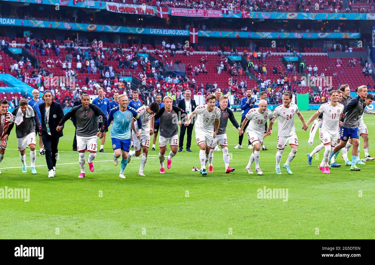 Denmark players celebrate victory after the final whistle during the UEFA Euro 2020 round of 16 match held at the Johan Cruijff ArenA in Amsterdam, Netherlands. Picture date: Saturday June 26, 2021. Stock Photo