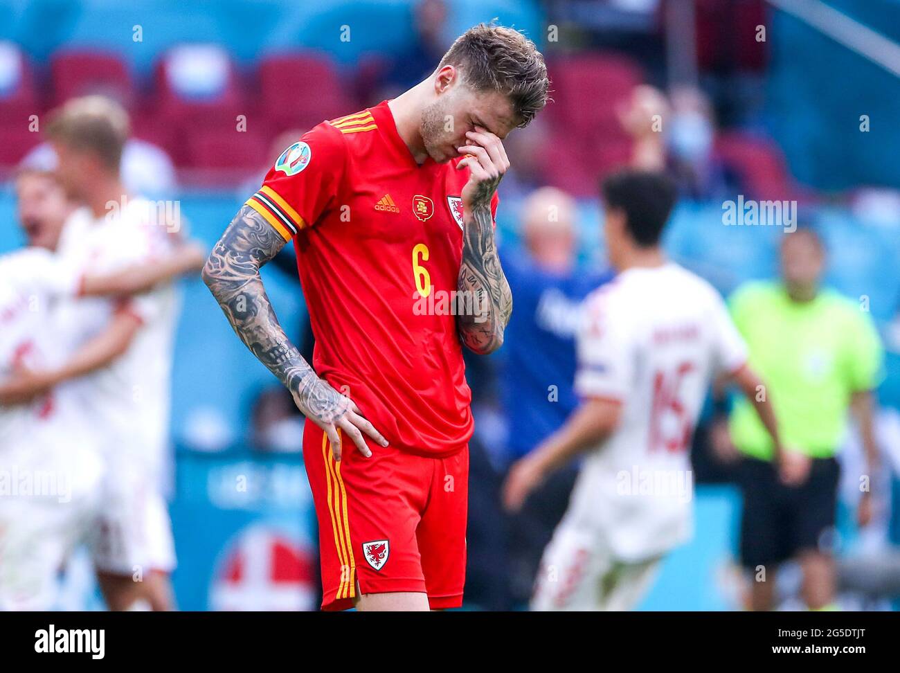 Wales' Joe Rodon appears dejected after the final whistle during the UEFA Euro 2020 round of 16 match held at the Johan Cruijff ArenA in Amsterdam, Netherlands. Picture date: Saturday June 26, 2021. Stock Photo