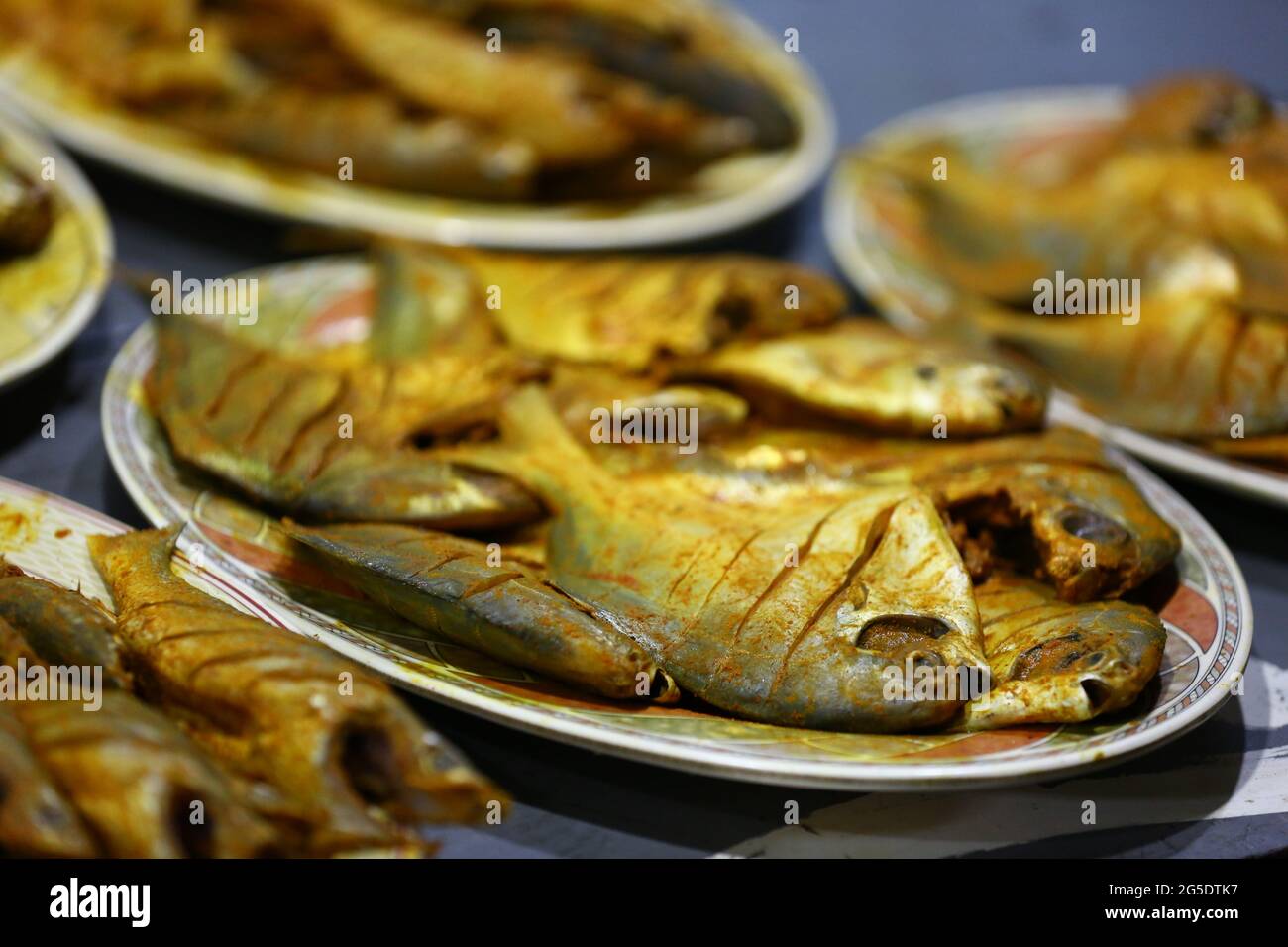Silver Pomfret fish with fry masala ready to cook Stock Photo Alamy