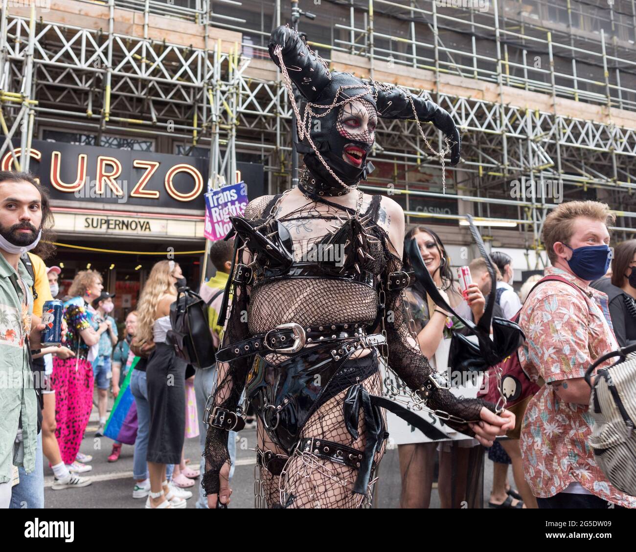London, UK. 26th June, 2021. A protestor seen wearing a fancy costume during the march.The Transgender Pride rally were coordinated by Socialist Workers, calling for protection of the rights of transgender people in the UK. The march took place in Leicester Square. Credit: SOPA Images Limited/Alamy Live News Stock Photo