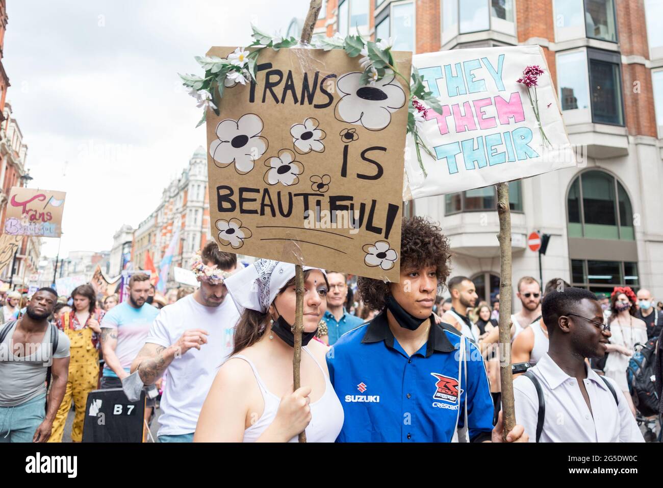 London, UK. 26th June, 2021. A protestor holding up a placard that reads 'trans is beautiful' during the march.The Transgender Pride rally were coordinated by Socialist Workers, calling for protection of the rights of transgender people in the UK. The march took place in Leicester Square. Credit: SOPA Images Limited/Alamy Live News Stock Photo