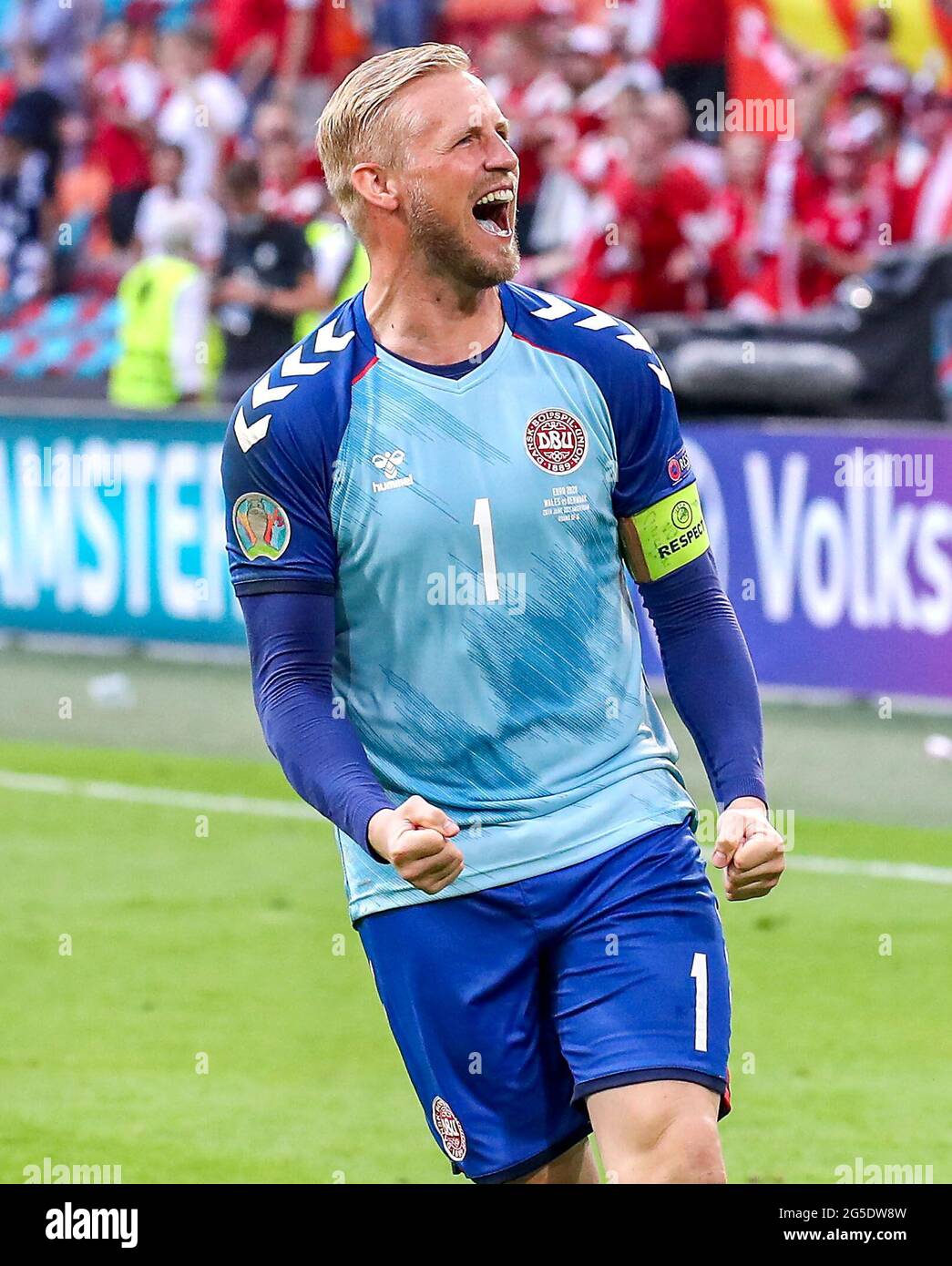 Denmark goalkeeper Kasper Schmeichel celebrates victory after the final whistle during the UEFA Euro 2020 round of 16 match held at the Johan Cruijff ArenA in Amsterdam, Netherlands. Picture date: Saturday June 26, 2021. Stock Photo