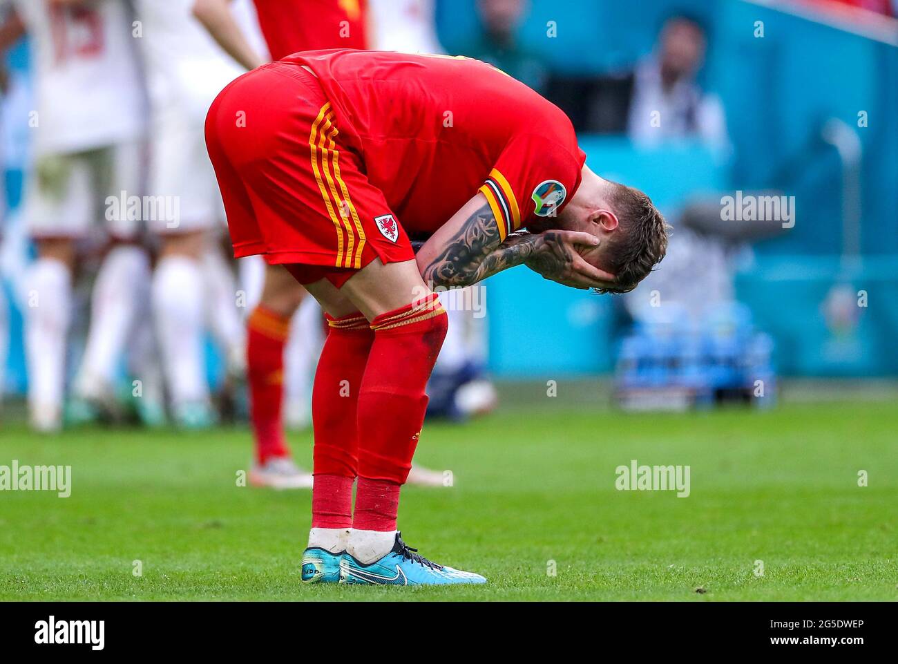 Wales' Joe Rodon appears dejected after defeat after the final whistle during the UEFA Euro 2020 round of 16 match held at the Johan Cruijff ArenA in Amsterdam, Netherlands. Picture date: Saturday June 26, 2021. Stock Photo