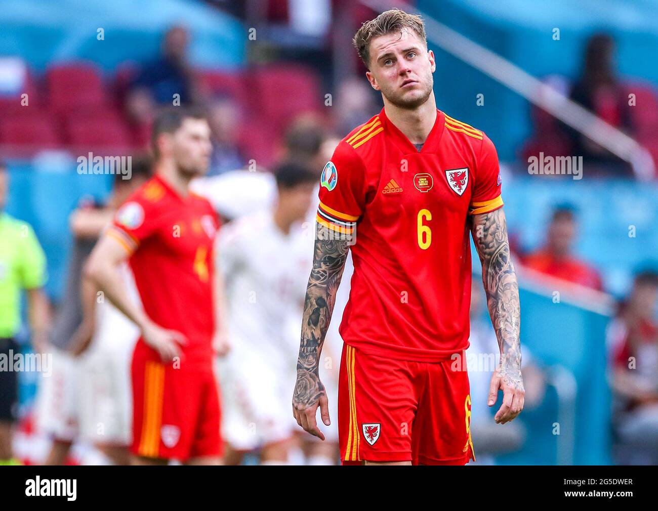 Wales' Joe Rodon appears dejected after defeat after the final whistle during the UEFA Euro 2020 round of 16 match held at the Johan Cruijff ArenA in Amsterdam, Netherlands. Picture date: Saturday June 26, 2021. Stock Photo