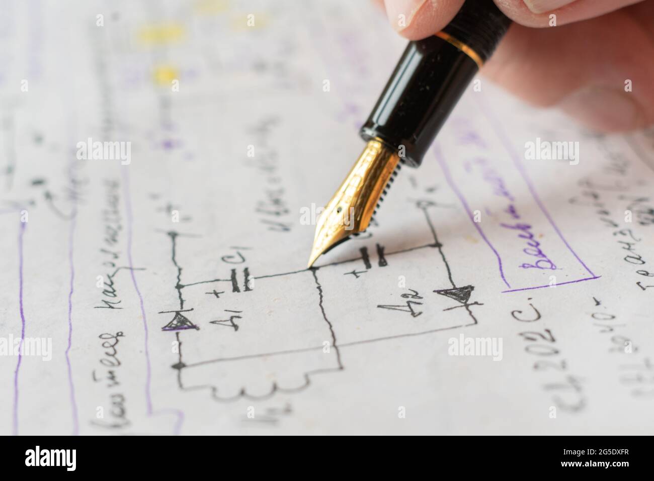 macro view of engineer planing the electrical circuit on paper Stock Photo