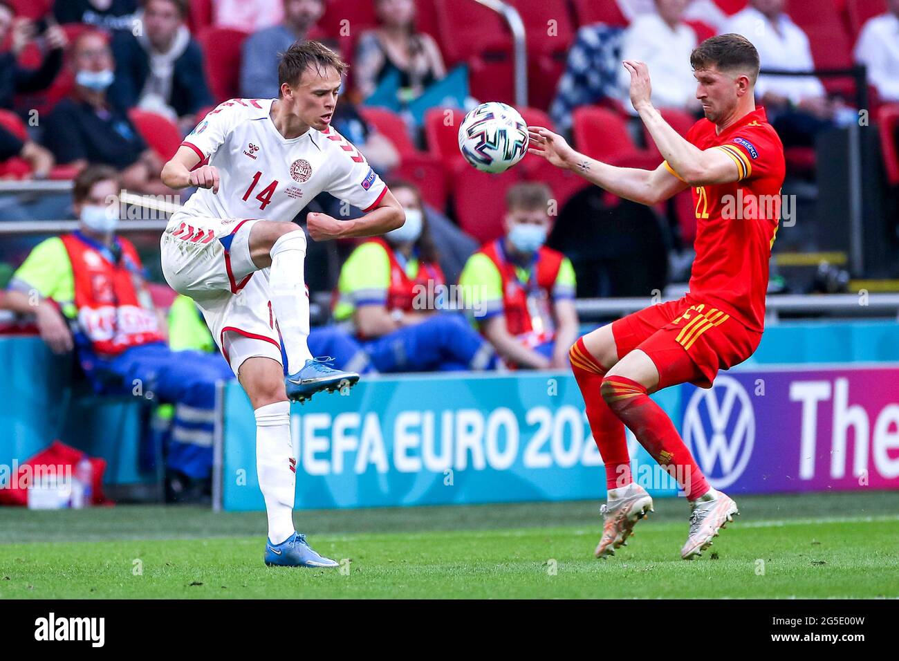 Denmark's Mikkel Damsgaard (left) and Wales' Chris Mepham battle for the ball during the UEFA Euro 2020 round of 16 match held at the Johan Cruijff ArenA in Amsterdam, Netherlands. Picture date: Saturday June 26, 2021. Stock Photo