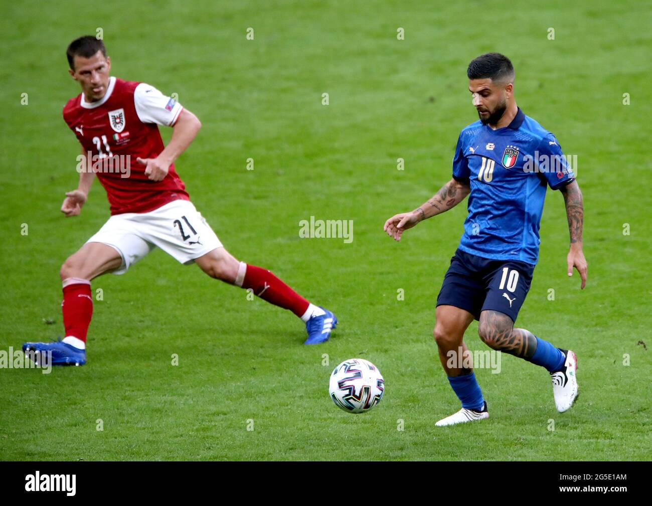 Italy's Lorenzo Insigne (right) and Austria's Stefan Lainer battle for the ball during the UEFA Euro 2020 round of 16 match held at Wembley Stadium, London. Picture date: Saturday June 26, 2021. Stock Photo