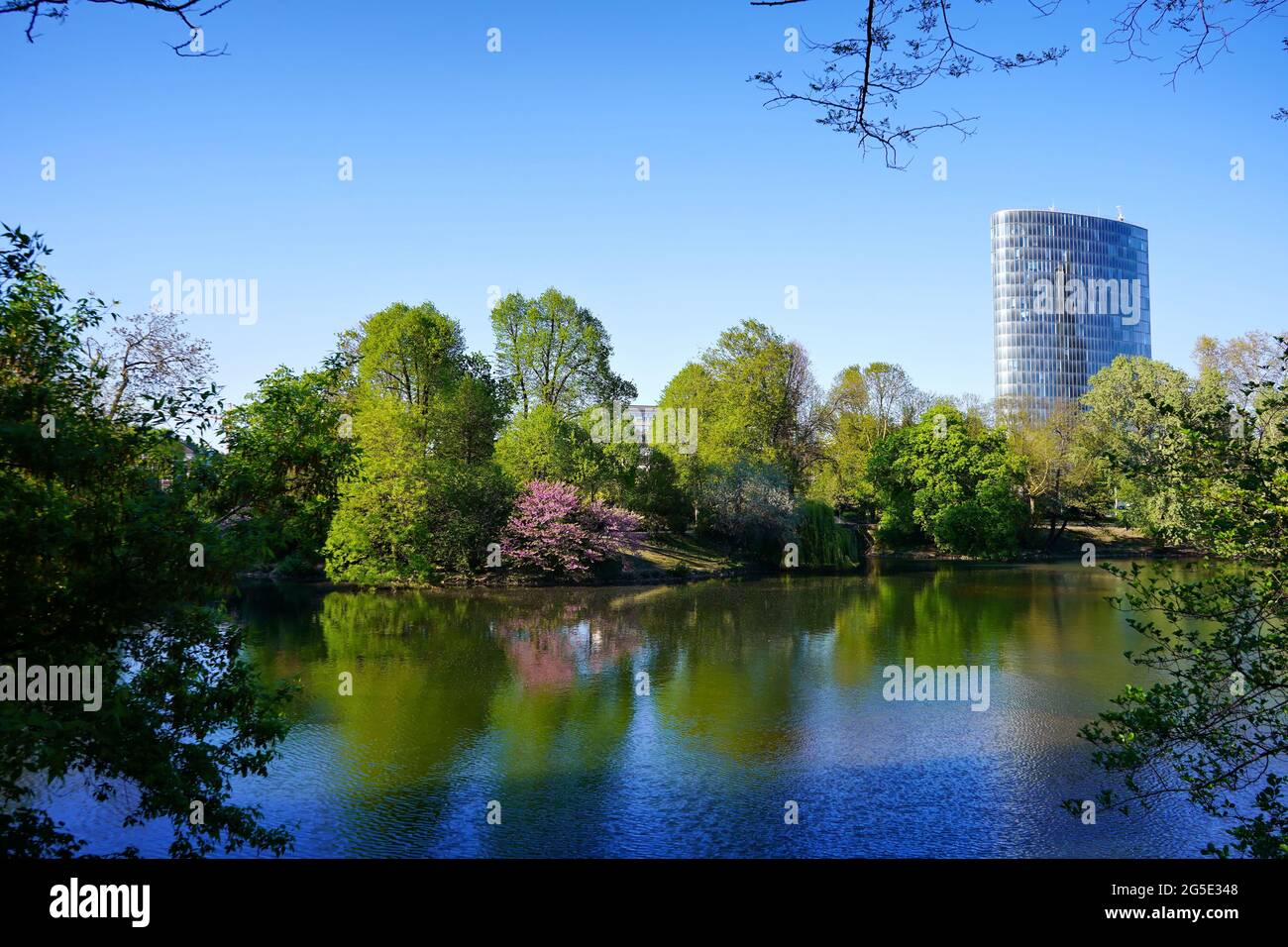 Schwanenspiegel public park in Düsseldorf, Germany, with modern office building in the background. The historic park was created around 1842. Stock Photo