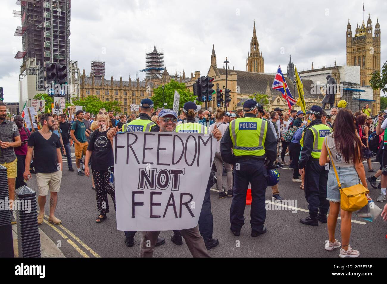 London, United Kingdom. 26th June 2021. Demonstrators march through Parliament Square. Anti-lockdown and anti-vaccination demonstrators gathered in Central London again, in protest against further lockdowns, masks and vaccination passports. (Credit: Vuk Valcic / Alamy Live News) Stock Photo