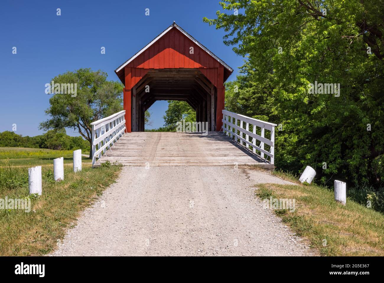 An old red wooden covered bridge in rural Iowa Stock Photo Alamy