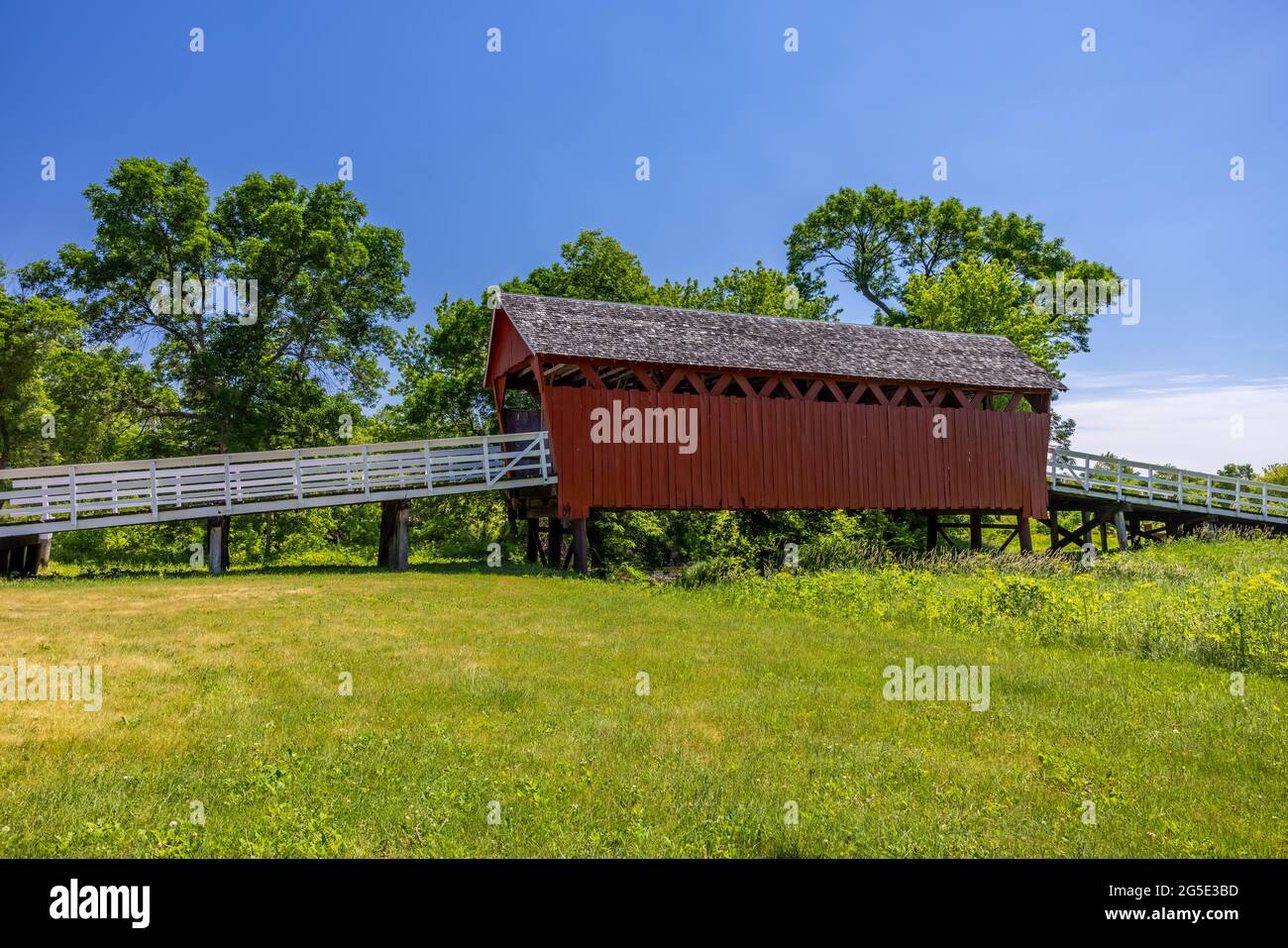 An old red wooden covered bridge in rural Iowa Stock Photo Alamy