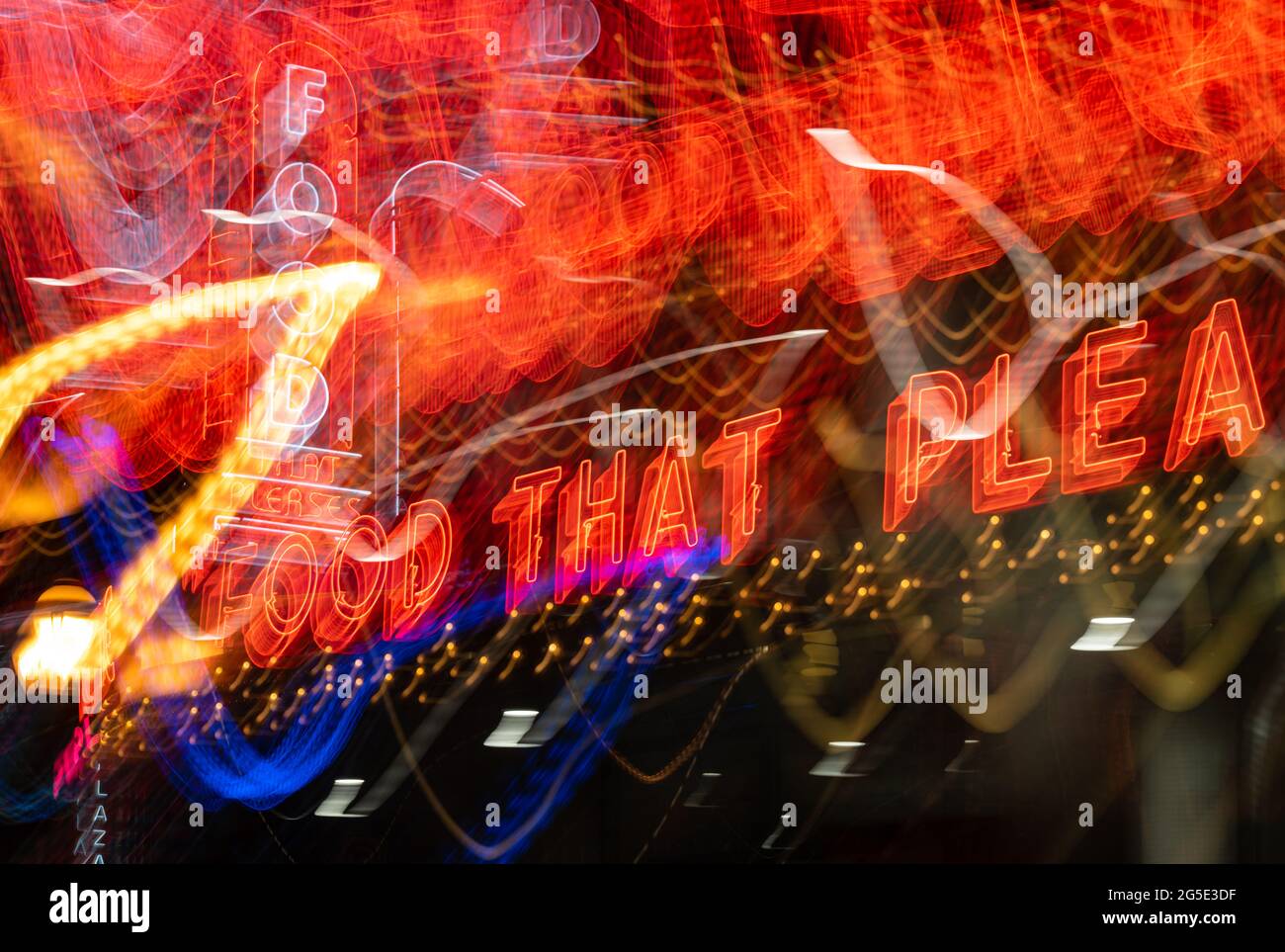 Blurred neon from Atlanta's retro Majestic Diner which boasts "Food that Pleases" in the Poncy-Highlands District on Ponce de Leon Avenue. (USA) Stock Photo