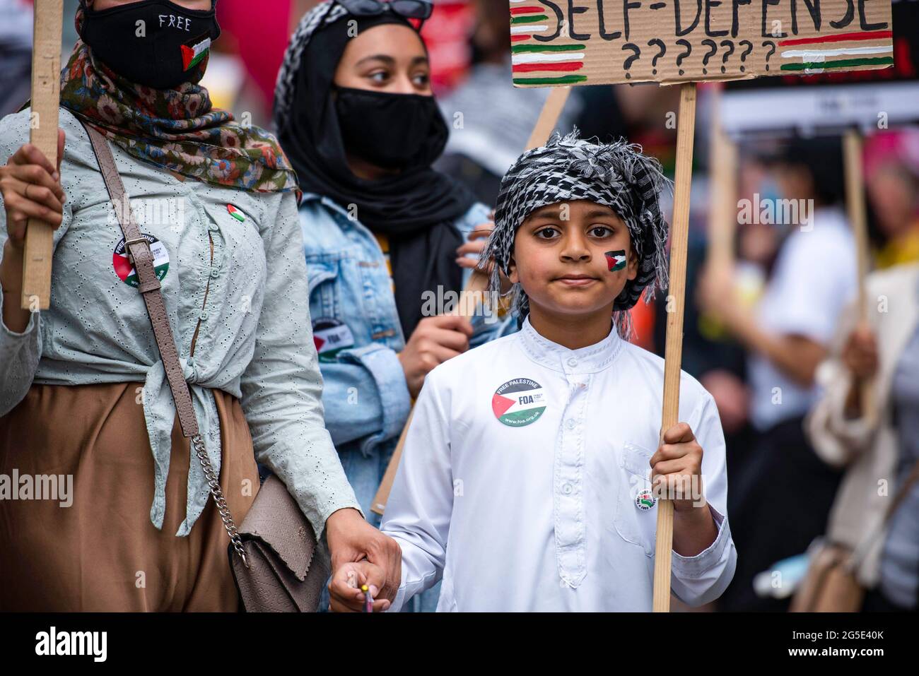 London, UK. 26th June, 2021. An activist holds a placard during the demonstration. People's Assembly held a National Protest in London demonstrating a plethora of issues from the Palestine and Israel conflict, coronavirus issues and the government handling of the pandemic, the police crime bill, and anti-arms matters. Credit: SOPA Images Limited/Alamy Live News Stock Photo