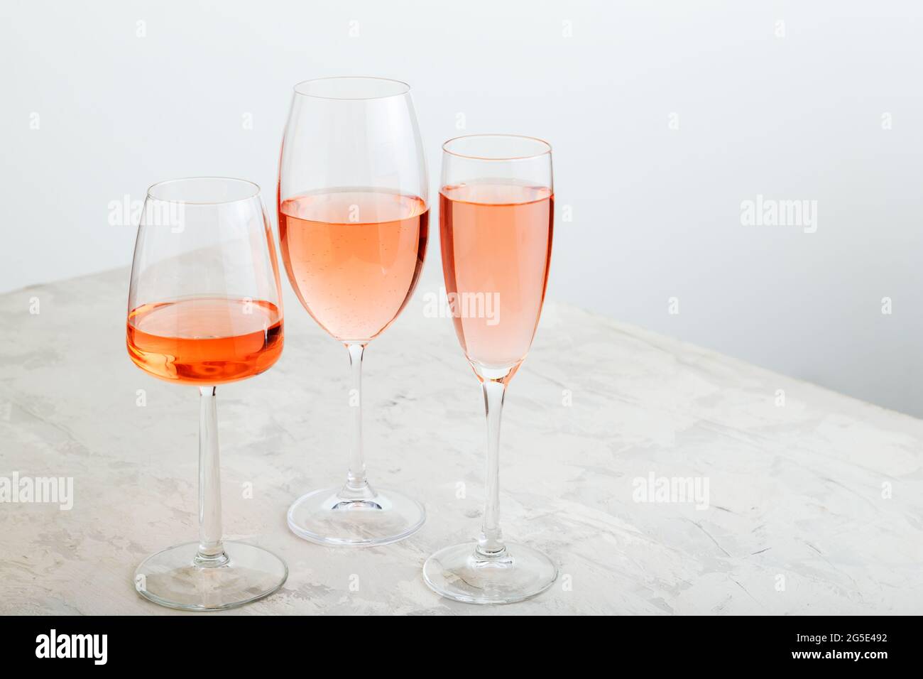 Rose wine summer drinks at wine tasting. Group glasses of pink wine on