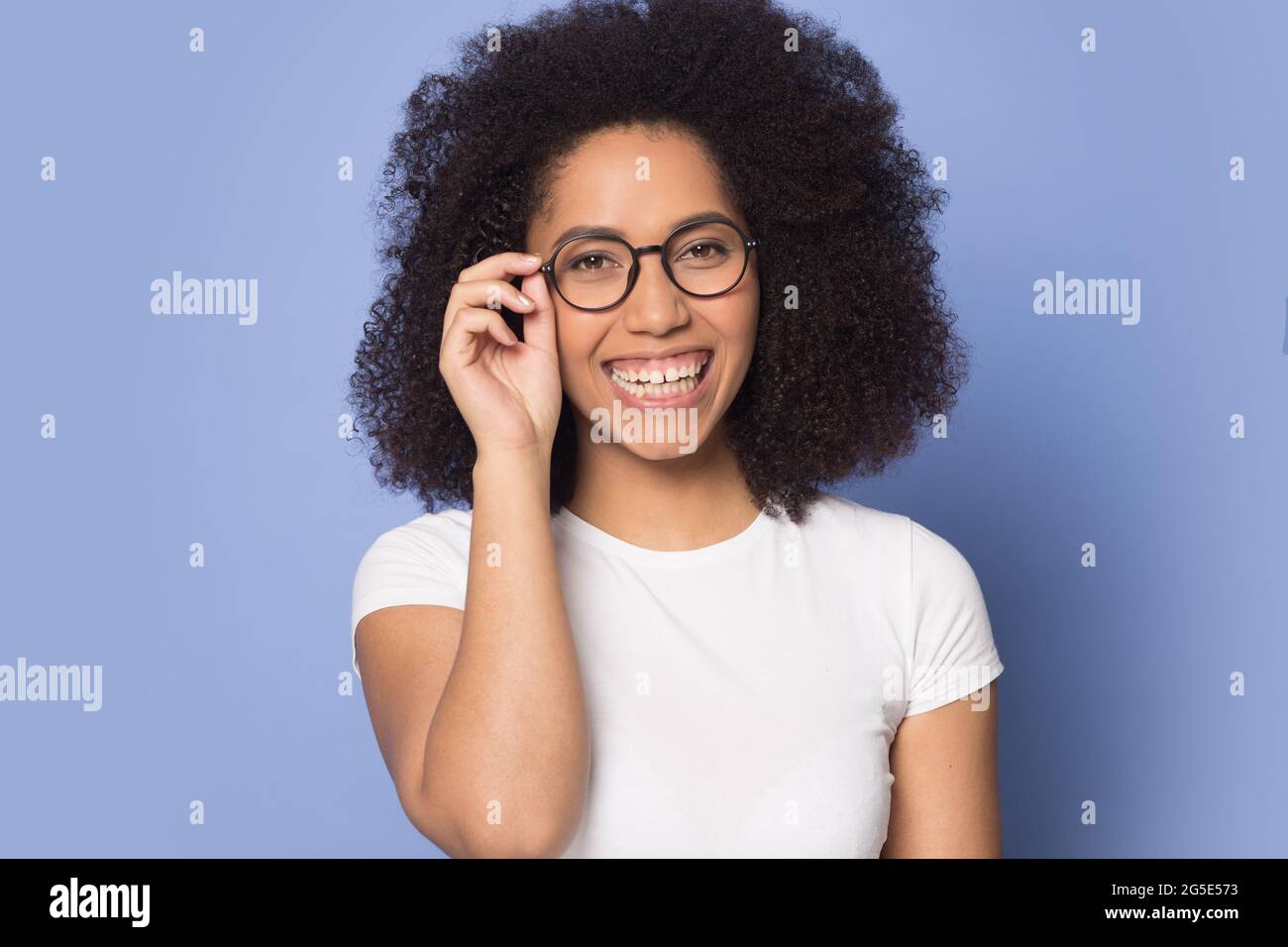 Portrait of smiling biracial woman wear glasses Stock Photo