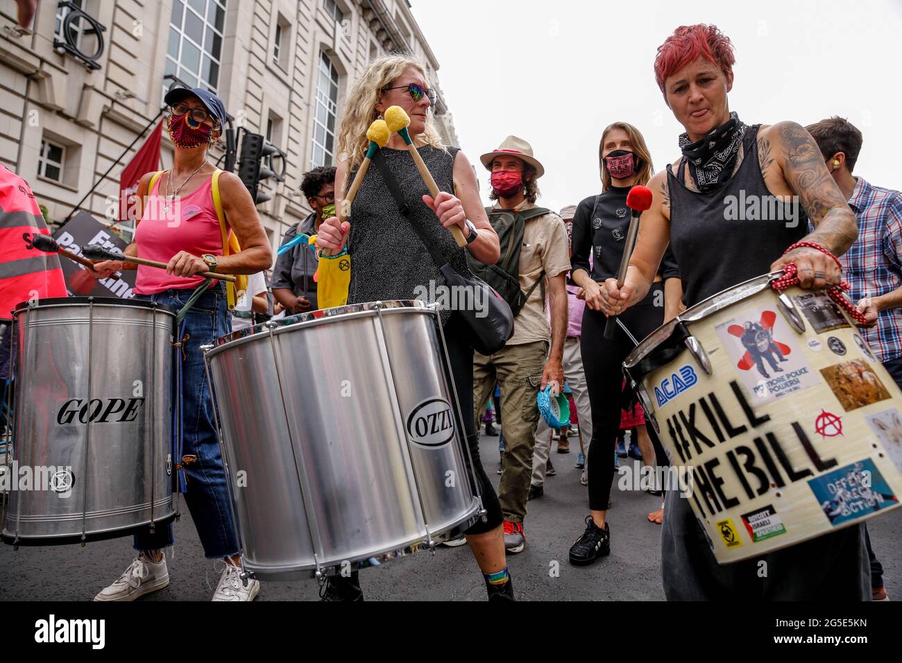 London,  UK on June 26, 2021: Anti-government activists  protest  Piccadilly Circus. The protest unites activists from many opposition left wing movements such as Kill the Bill, The People's Assembly, NHS Staff Voices, Stop the War Coalition or Extintion Rebellion. Stock Photo