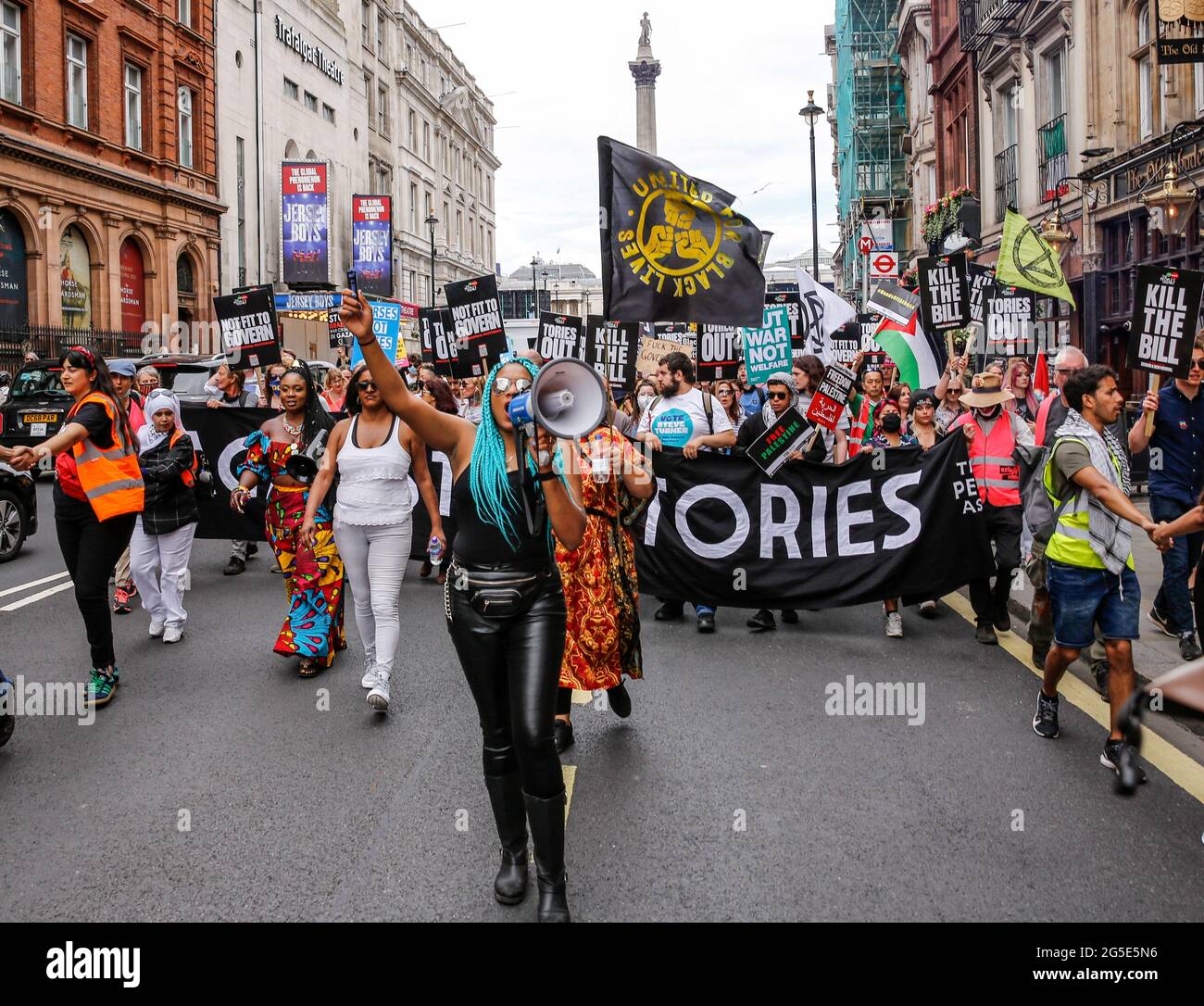 London,  UK on June 26, 2021: Anti-government activists  protest at Trafalgar Square. The protest unites activists from many opposition left wing movements such as Kill the Bill, The People's Assembly, NHS Staff Voices, Stop the War Coalition or Extintion Rebellion. Stock Photo
