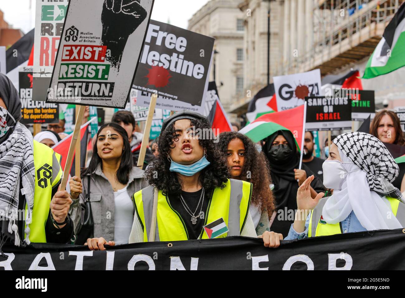 London,  UK on June 26, 2021: Pro Palestinian artivists join anti-government protest at Whitehall Street in the centre of London. The protest unites activists from many opposition left wing movements such as Kill the Bill, The People's Assembly, NHS Staff Voices, Stop the War Coalition or Extintion Rebellion. Stock Photo