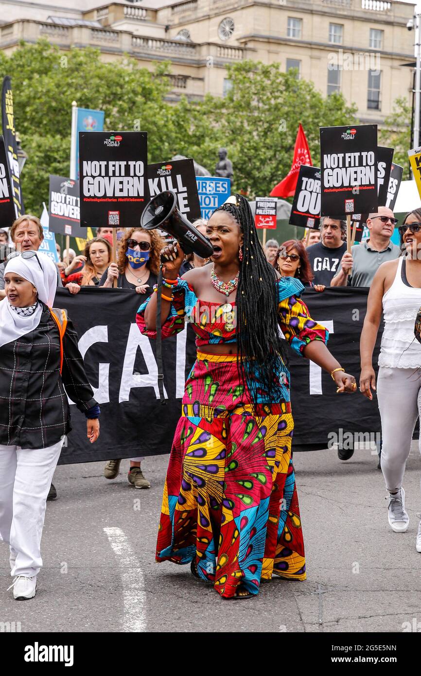 London,  UK on June 26, 2021: Anti-government activists  protest at Trafalgar Square. The protest unites activists from many opposition left wing movements such as Kill the Bill, The People's Assembly, NHS Staff Voices, Stop the War Coalition or Extintion Rebellion. Stock Photo