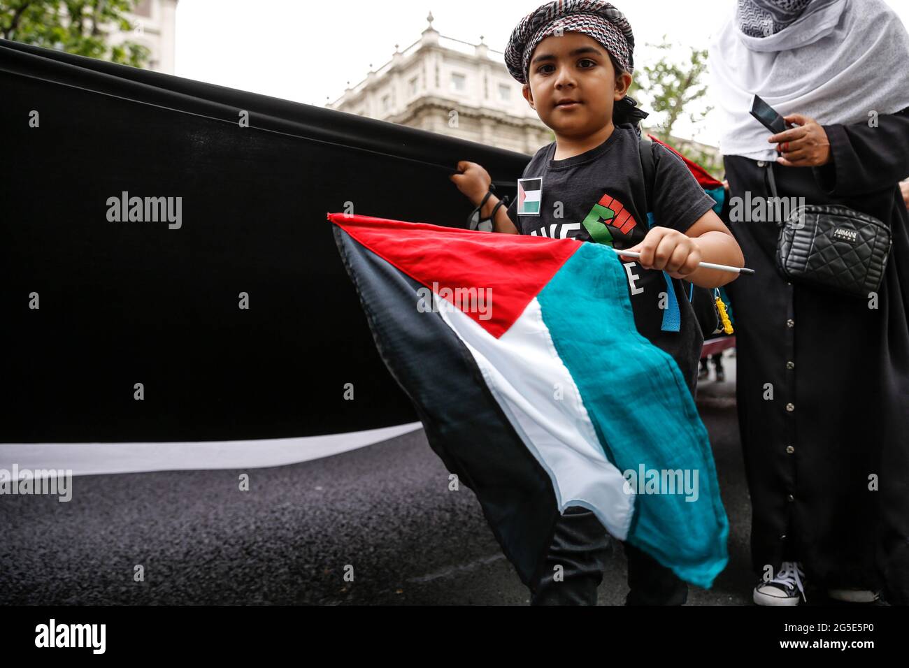 London,  UK on June 26, 2021: Pro Palestinian artivists join anti-government protest at Whitehall Street. The protest unites activists from many opposition left wing movements such as Kill the Bill, The People's Assembly, NHS Staff Voices, Stop the War Coalition or Extintion Rebellion. Stock Photo