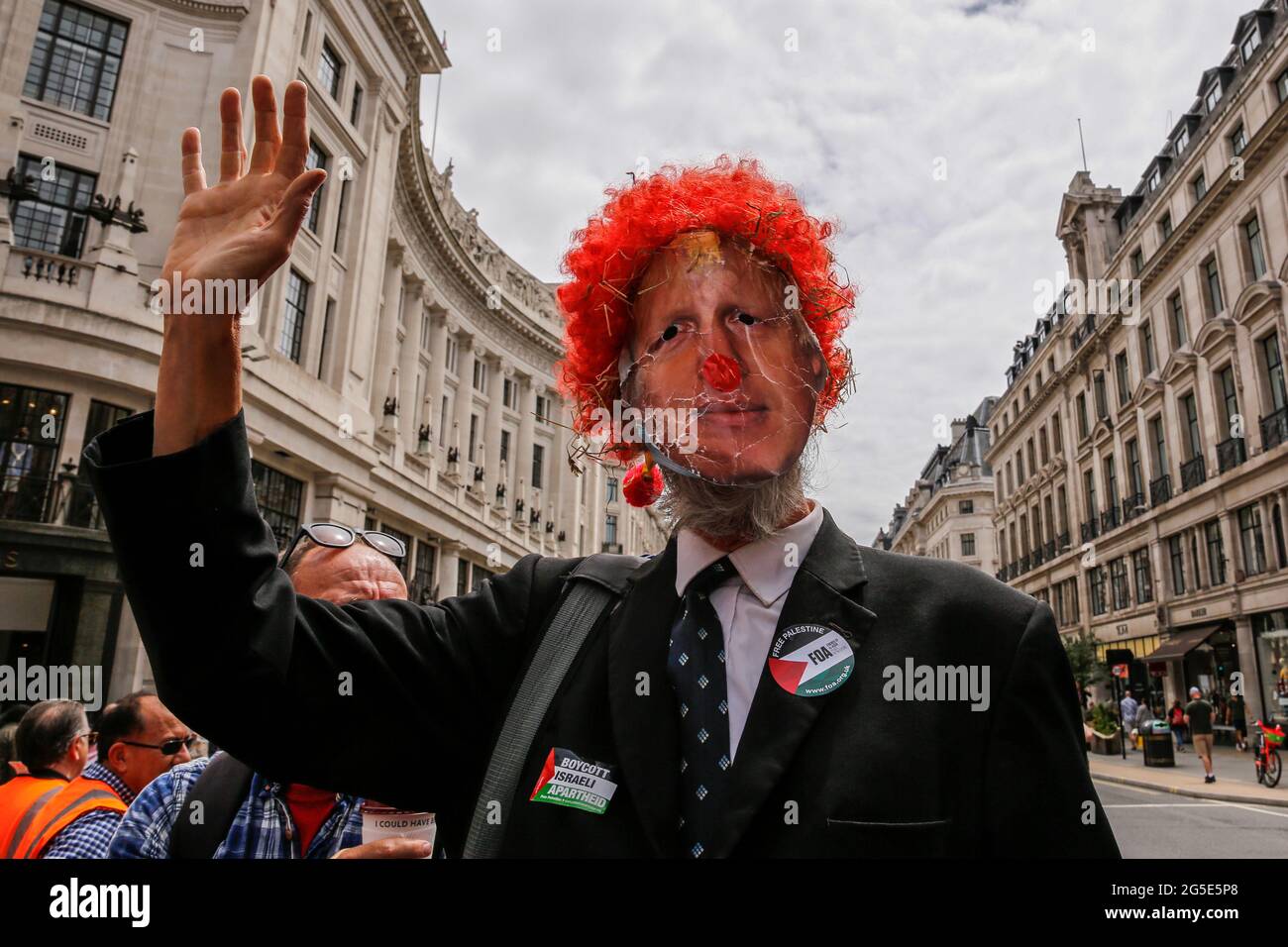 London,  UK on June 26, 2021: Anti-government activists  protest at Regent Street in the centre of the city. The protest unites activists from many opposition left wing movements such as Kill the Bill, The People's Assembly, NHS Staff Voices, Stop the War Coalition or Extintion Rebellion. Stock Photo