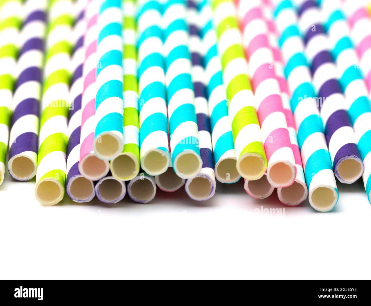 Stripped Paper Straws on a White Background Stock Photo