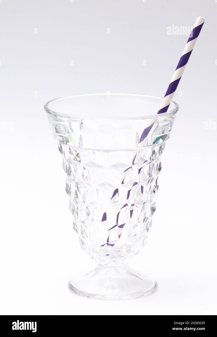 Stripped Paper Straws on a White Background Stock Photo
