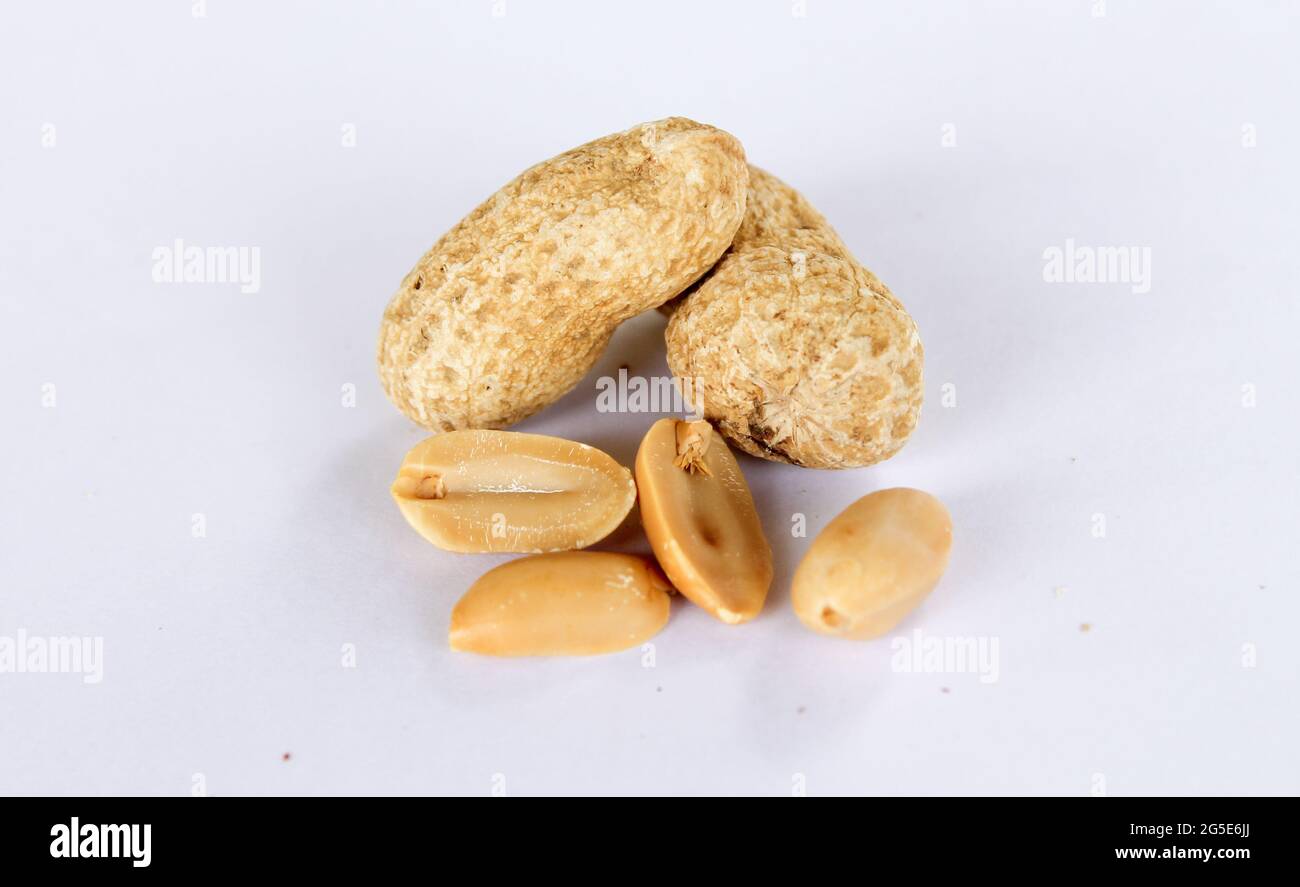 Peanuts isolated on a white background. There are separate peanut kernels. close-up photo Stock Photo